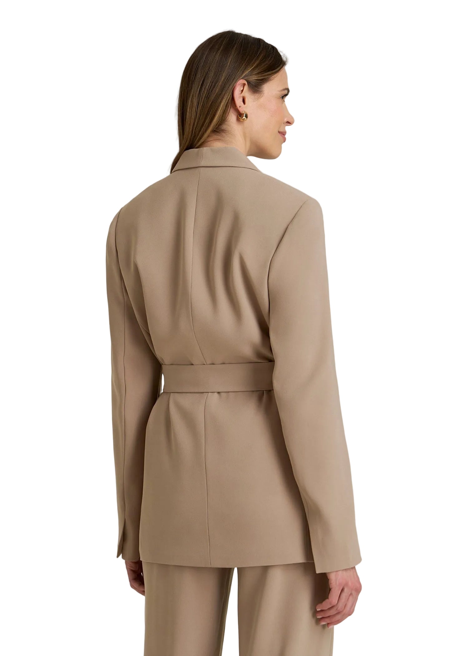 Woman wearing a beige trench coat on a plain background