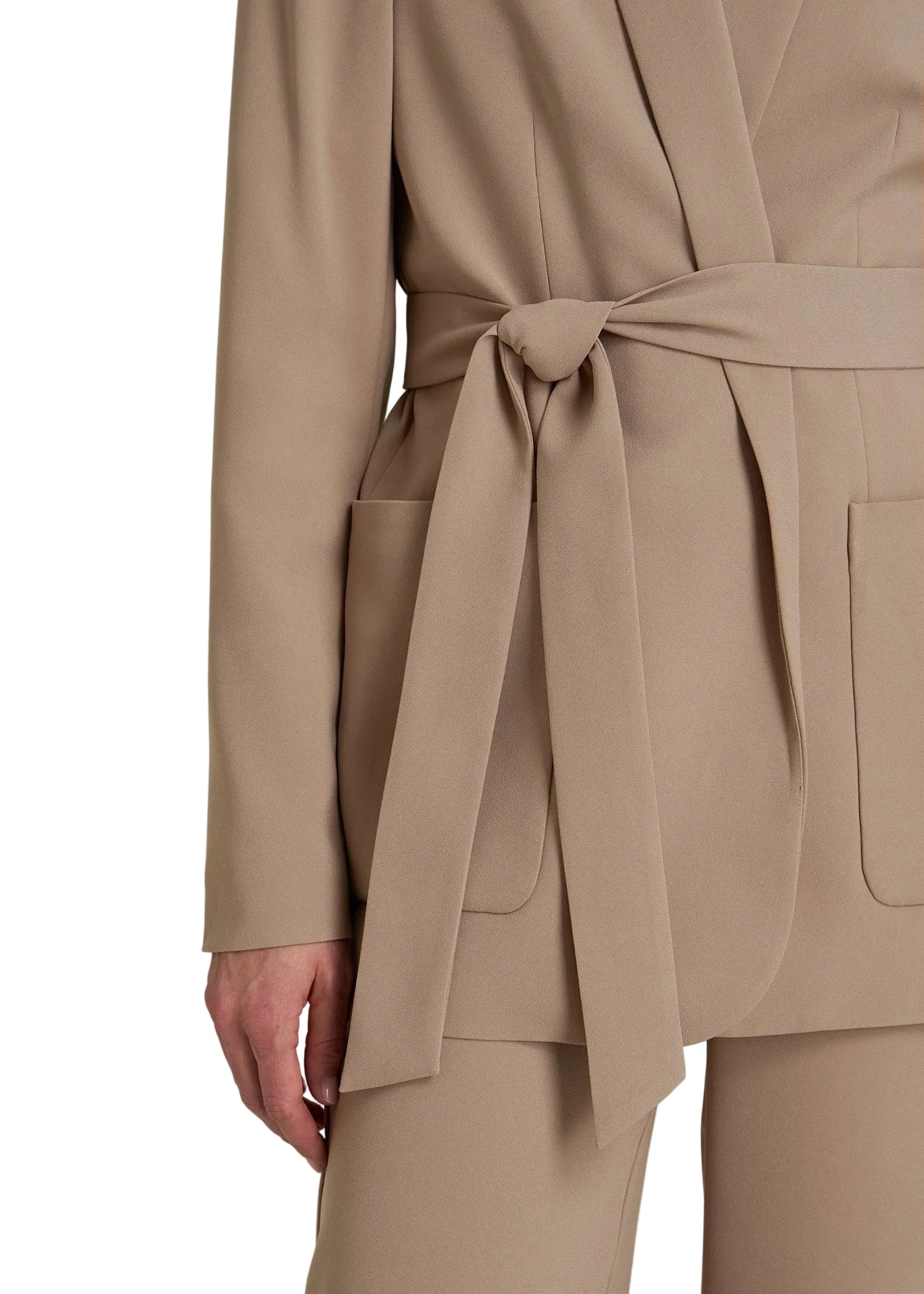 Beige trench coat with a belt on a plain background