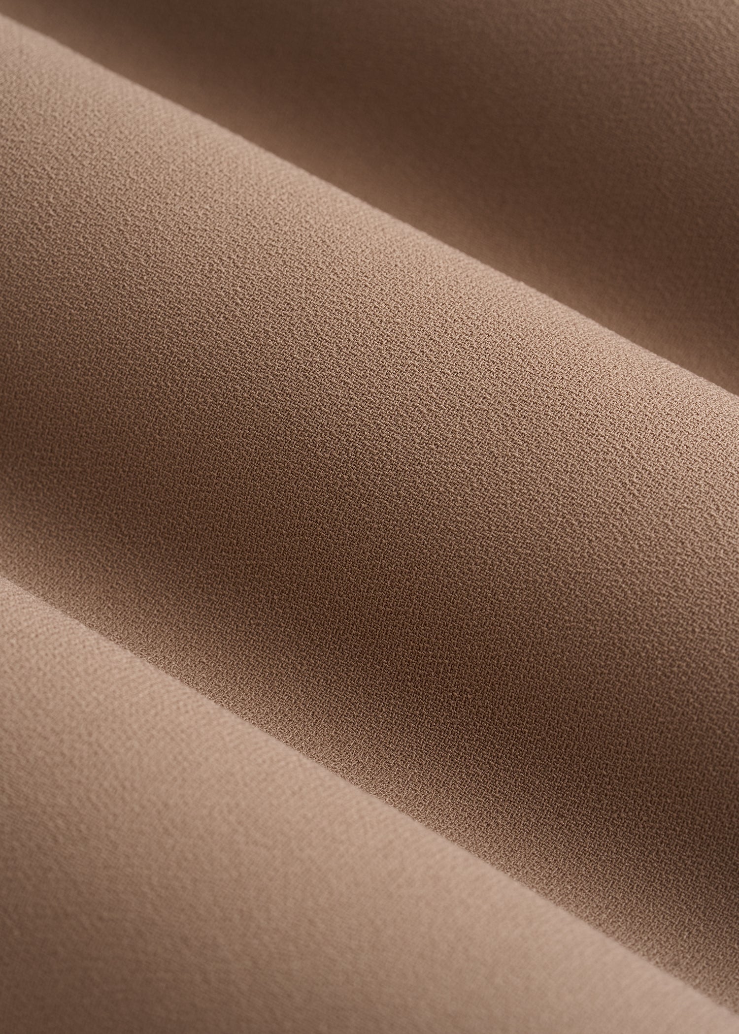 Close-up of brown fabric with visible texture
