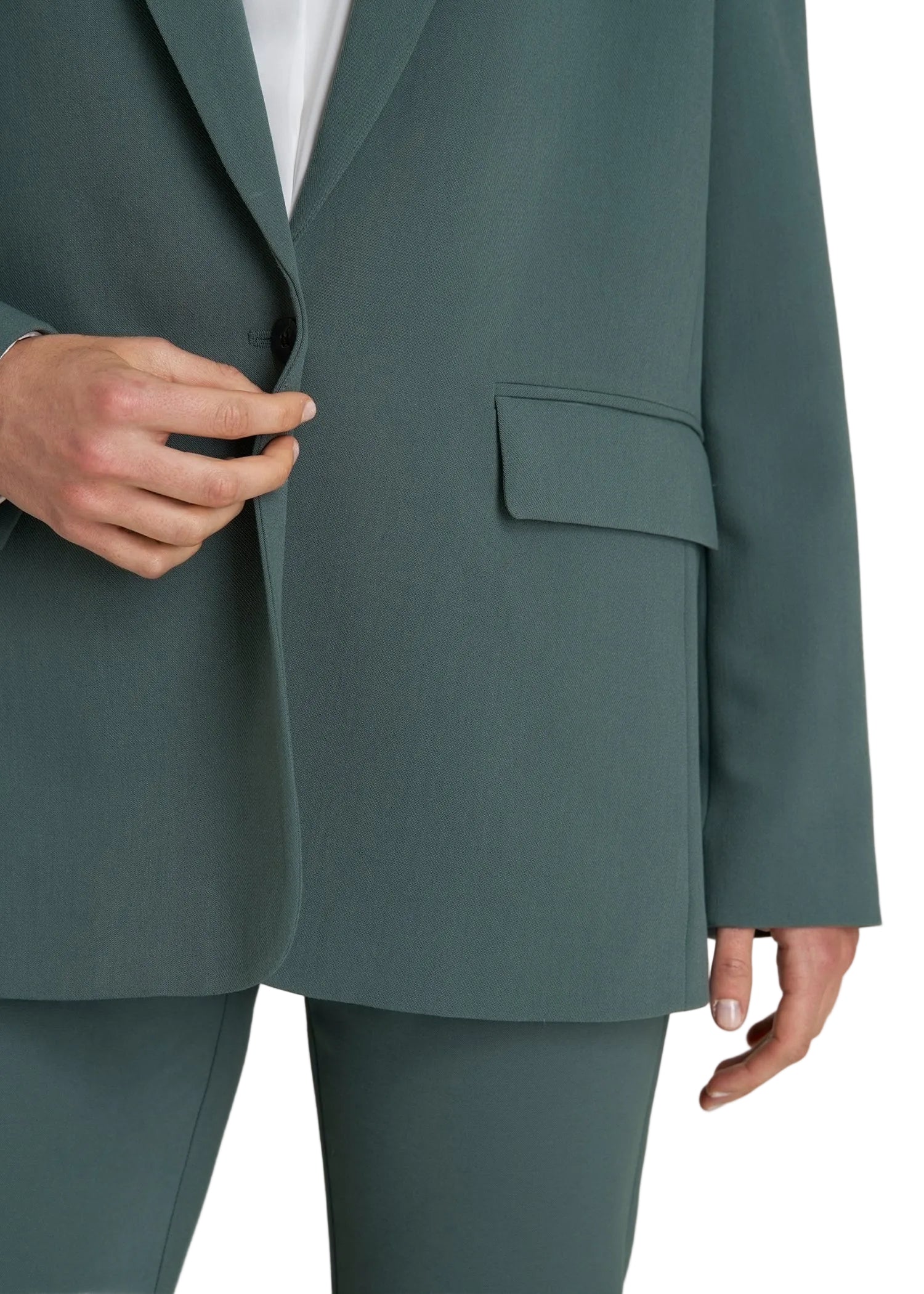 Teal suit jacket and pants on a neutral background