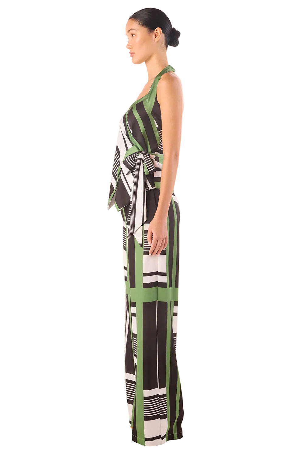 Woman wearing a patterned dress on a white background