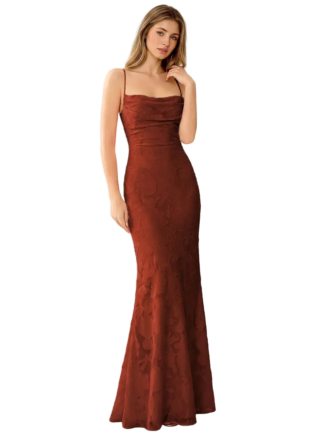 Woman wearing a rust-colored evening gown against a white background