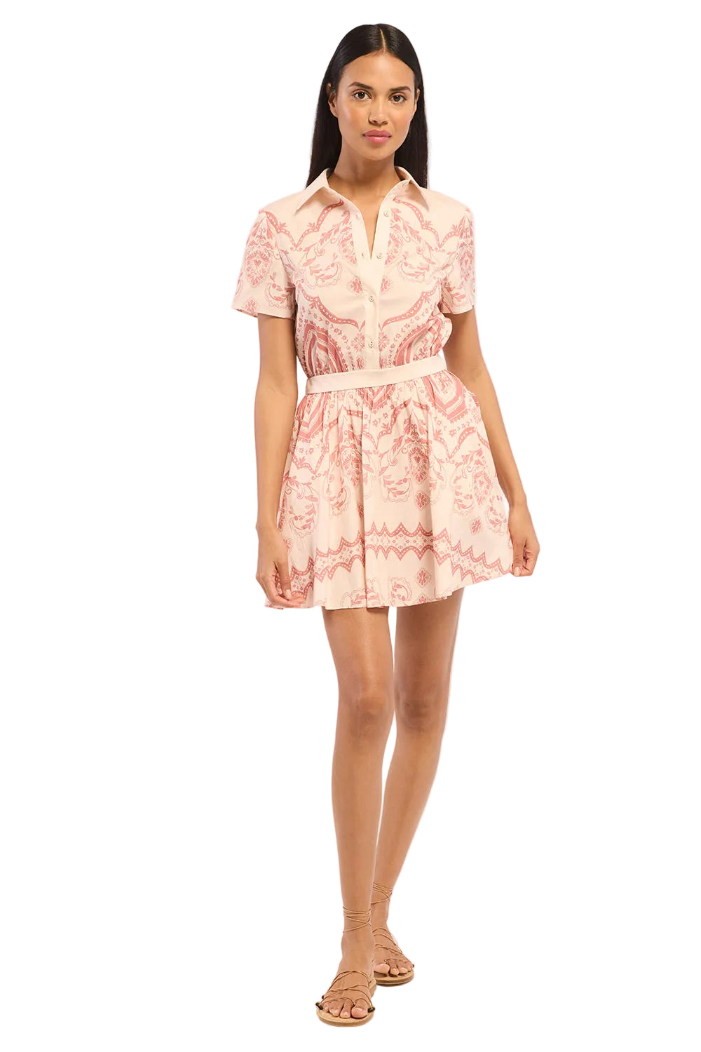 Woman wearing a pink floral dress on a white background